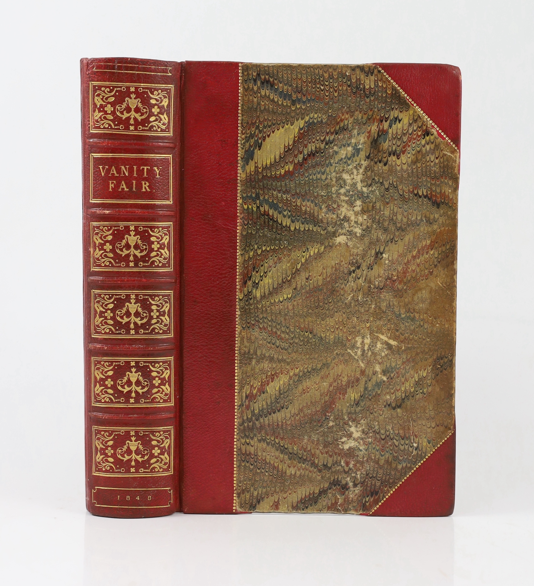 Thackeray, William Makepeace - Vanity Fair. A novel without a hero. First Edition. pictorial engraved and printed titles, frontis. and 38 other plates (by the author), engraved text illus.; later 19th century red half mo